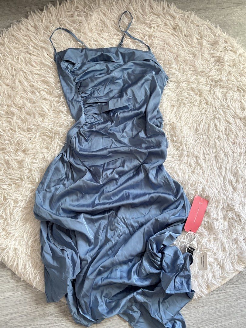 SHEIN Blue Satin Ruched Midi Dress (Category: Dresses) located in Quezon City. Submitted by lovedbysloane (Listing ID 1468596294, Image 1). Description: - Can fit M-L - Brand new with tags (BNWT), never worn - Size: L (true to size) - Color: Dusty blue - Material: Silky satin finish - Design: Spaghetti straps, elegant cowl neckline, and flattering side ruching - Occasion: Ideal for weddings, parties, and formal events.
