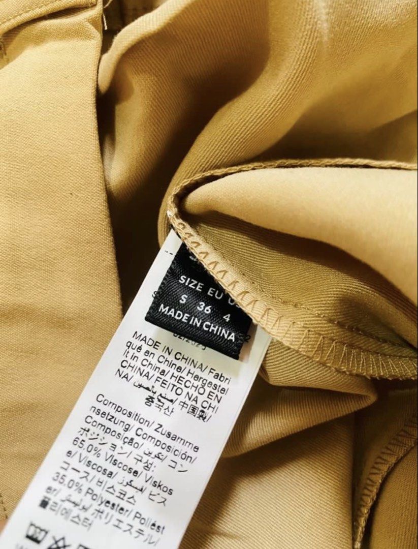 SHEIN Khaki Flare Pants (Category: Jeans) located in Marikina City. Submitted by jessylady10 (Listing ID 1468628263, Image 2). Description: - Brand: SHEIN - Color: Khaki - Size: Small on tag, but medium size - Material: 65% Viscose, 35% Polyester - Features: Zip fly with button closure, belt loops - Condition: Brand new with original packaging bag.
