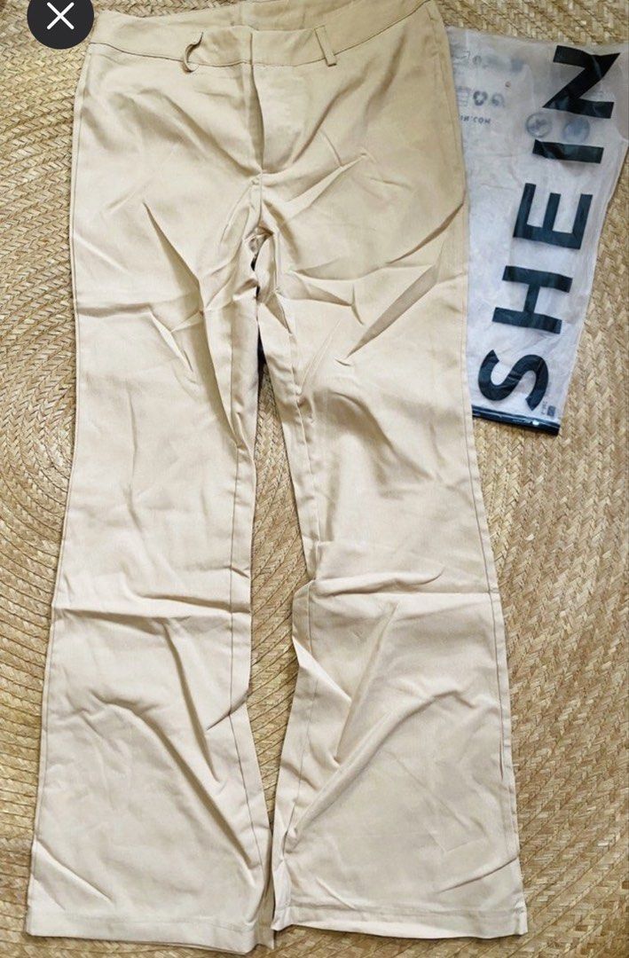 SHEIN Khaki Flare Pants (Category: Jeans) located in Marikina City. Submitted by jessylady10 (Listing ID 1468628263, Image 1). Description: - Brand: SHEIN - Color: Khaki - Size: Small on tag, but medium size - Material: 65% Viscose, 35% Polyester - Features: Zip fly with button closure, belt loops - Condition: Brand new with original packaging bag.