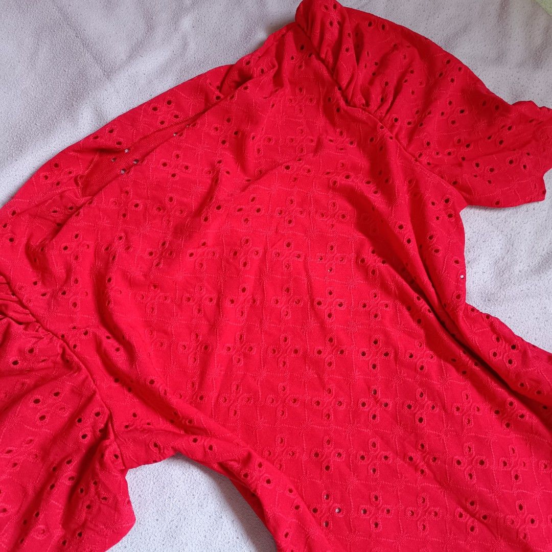 Shein Red Eyelet Bodysuit Size L (Category: Blouses) located in Manila. Submitted by its.me.jo (Listing ID 1468550787, Image 2). Description: - Color: Bright red - Brand: Shein - Size: L (Fits US 8/10 or EU 40/42) - Design: Eyelet cutout pattern, square neckline, and trendy puff short sleeves - Closure: Convenient bottom snap buttons - Material: 95% polyester, 5% elastane (stretchy and comfortable) - Care: Machine washable.