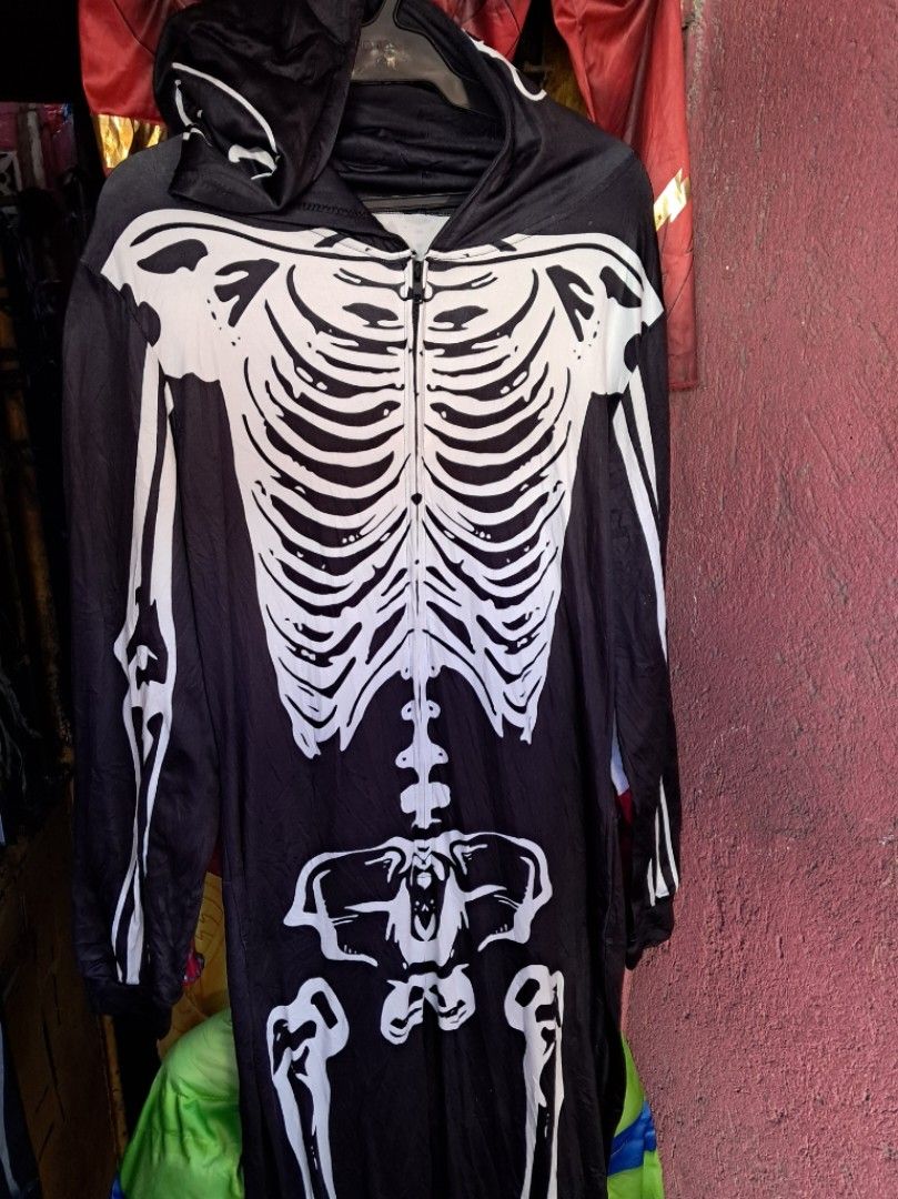 Skeleton onesie jumpsuit size medium to large pp (Category: Coats, Jackets and Outerwear) located in Las Pinas. Submitted by kaswakto (Listing ID 1468507388, Image 3). Description: 〽️Skeleton onesie jumpsuit black-and-white with a front zipper and attached hood, commonly worn as a Halloween costume or cozy pajama.size medium to large 〽️ Dimensions: 60 inches length x 19-23 inches width 〽️ excellent condition no issues 💰Php 550 +sf 📌Lpdh Las Pin