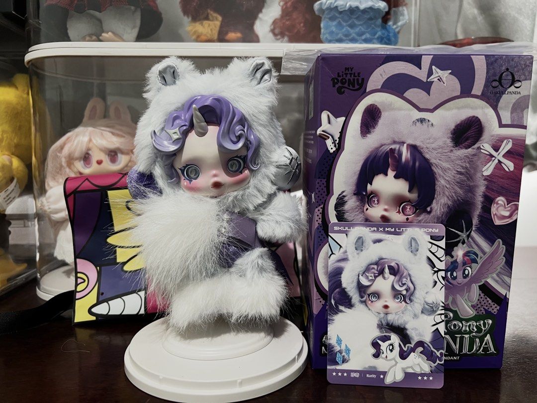 SKULLPANDA X MLP - Rarity (Category: Plushies & Soft Toys) located in Valenzuela. Submitted by greyzeep (Listing ID 1468550469, Image 1). Description: Rarity - Skullpanda X My Little Pony ₱1,000 only from PopNow 💜💜💜 Doll displayed on sealed acrylic case ONLY Complete inclusions (box, hair net, pouch and card) ❗️Please see minimal factory issue on photos posted (pink dot on hair, not noticeable) RFS: Downsizing collection 📝Pay as you order Mod