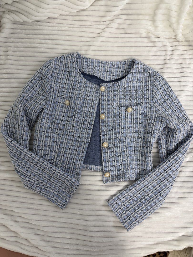 Sky Blue Tweed Cropped Jacket with Pearl Buttons (Category: Coats, Jackets and Outerwear) located in Rizal. Submitted by kianapreloves (Listing ID 1468679743, Image 1). Description: - Color: Blue and black tweed - Style: Cropped jacket with structured shape - Neckline: Classic round neckline - Closure & Accents: Front button closure and chest flap pockets with elegant faux pearl hardware - Length: Short cut, hits near the waistline - Interior: Fu