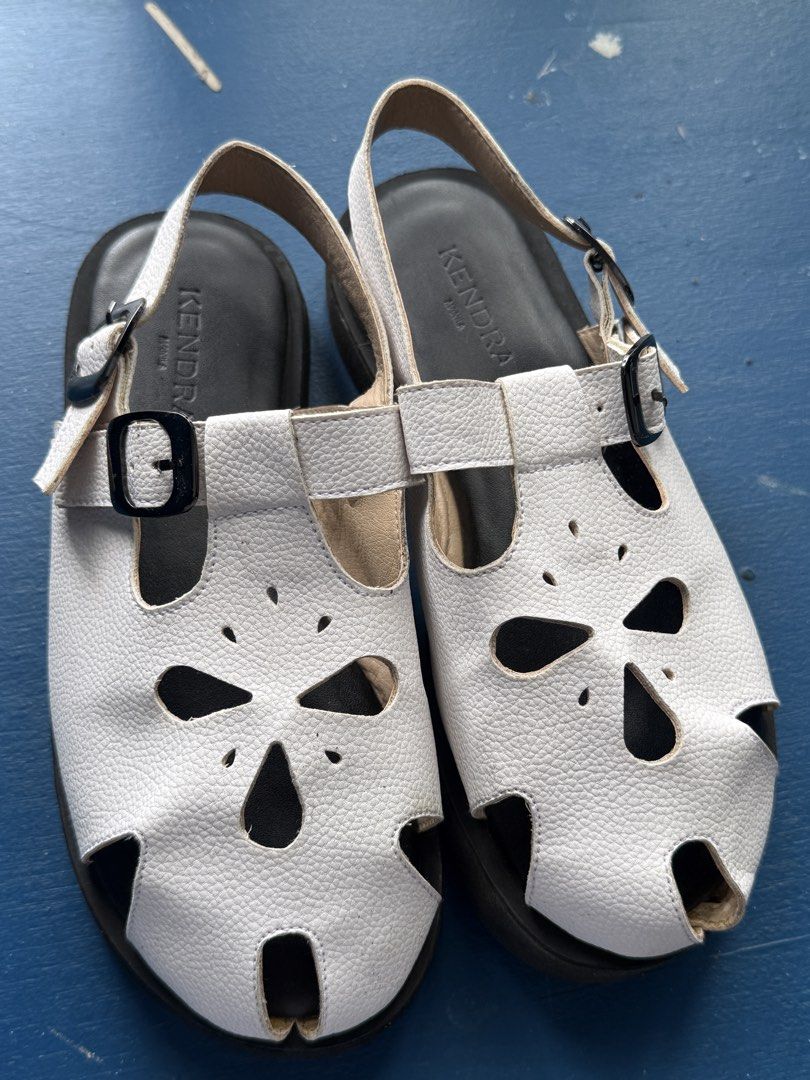 Slip On Sandals White Size 6 (Category: Flats & Sandals) located in Iloilo. Submitted by qwertrisha (Listing ID 1468510919, Image 3). Description: - Brand/Model: Kendra Manila Astra Slip-on Sandals - Color: White - Size: 6 - Material: Textured faux leather with laser-cut floral details USED ONLY ONCE. VERY COMFORTABLE TO USE AND VERY LIGHT WEIGHT.