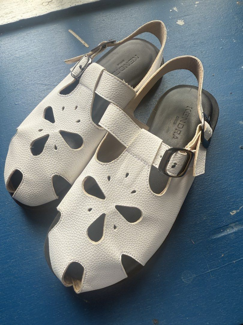 Slip On Sandals White Size 6 (Category: Flats & Sandals) located in Iloilo. Submitted by qwertrisha (Listing ID 1468510919, Image 1). Description: - Brand/Model: Kendra Manila Astra Slip-on Sandals - Color: White - Size: 6 - Material: Textured faux leather with laser-cut floral details USED ONLY ONCE. VERY COMFORTABLE TO USE AND VERY LIGHT WEIGHT.