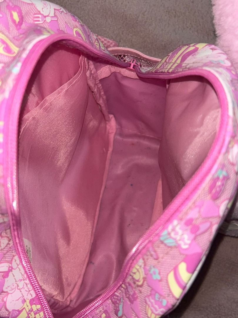 Smiggle Backpack with Removable Plush Toy Pink (Category: Backpacks) located in Las Pinas. Submitted by whatzupriley (Listing ID 1468549755, Image 2). Description: - Brand: Smiggle Teeny Tiny - Design: Bright pink with all-over dessert and bunny pattern - Bonus: Includes a detachable fluffy pink bunny plush toy - Features: Pink mesh side pockets and adjustable straps - see photos for details - Ideal for: Kids.