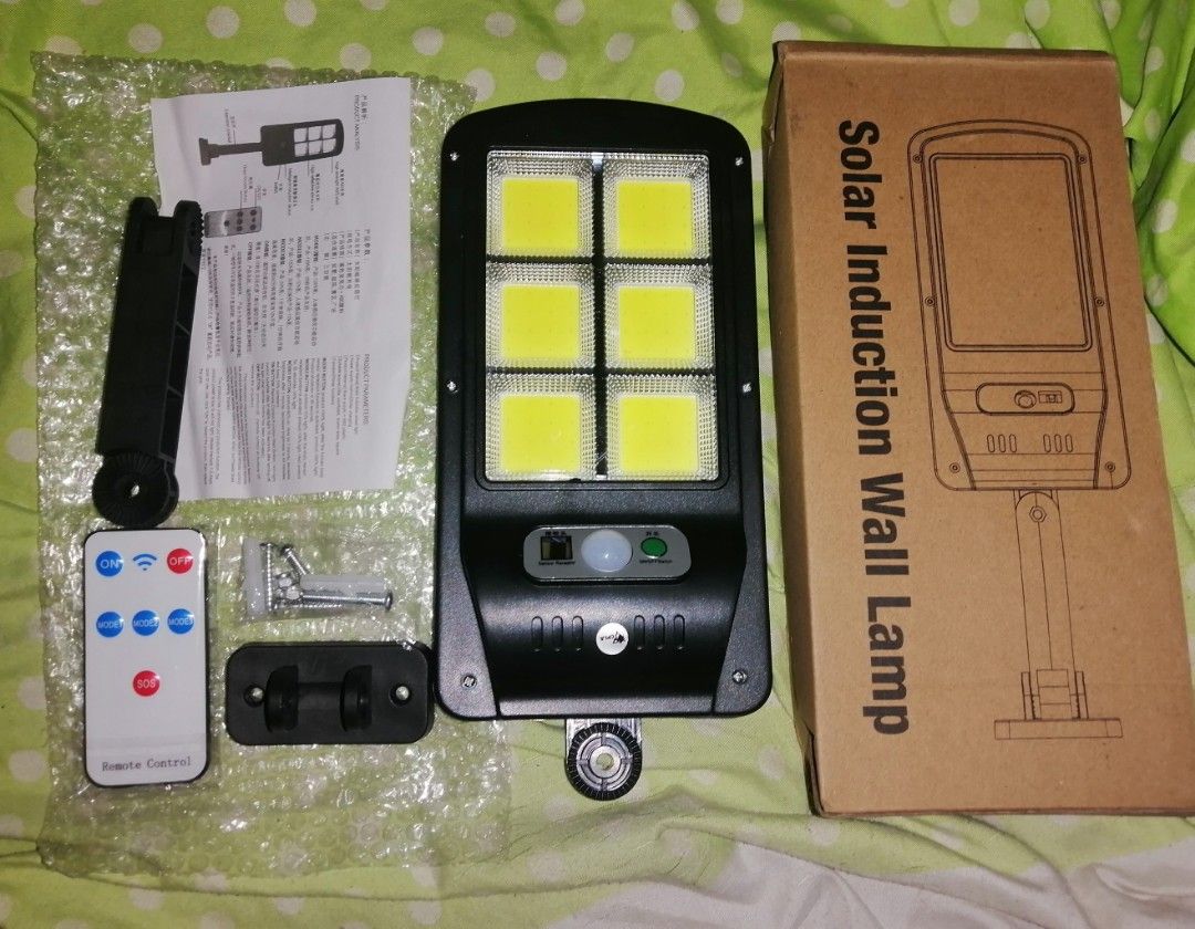 Solar Induction Wall Lamp with Remote Control (Category: Lighting) located in Quezon City. Submitted by rolenalma (Listing ID 1468695970, Image 1). Description: - Type: Solar induction outdoor wall lamp - Lighting: Bright LED panels with built-in solar panel - Features: Motion sensor and convenient remote control included - Installation: Easy to mount on walls, fences, or patios - Inclusions: Wall mount bracket, screws, anchors, instruction manua