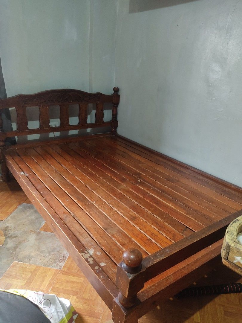 Solid Wood Bed Frame (RUSH SALE) (Category: Bed Frames & Mattresses) located in Caloocan City. Submitted by eri.grass_ (Listing ID 1468523186, Image 2). Description: - Type: Wooden bed frame (Standard double or queen size) - Note: Mattress is not included ‼️ RUSH SALE ‼️ Kunin niyo na po today. South Caloocan Brgy. 16 ang location. ₱1,500 na lang pero slightly negotiable pa rin basta sure buyer. May minor crack lang sa kahoy pero di lumulundo. Ma