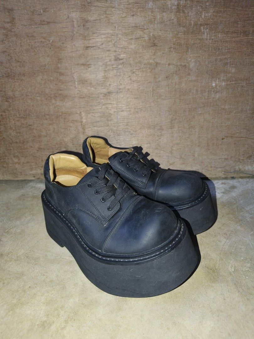 Sonder Plan Black Derby Chunky shoes (Category: Loafers) located in Davao. Submitted by vndrgd (Listing ID 1468607849, Image 2). Description: - Color: Black with tan inner lining - Style: Chunky platform shoes with thick, heavy rubber soles - Design: Round toe, lace-up front closure, super bold silhouette - Condition: Light scuffs on the toe caps and edges of the platform - Styling: Great for alt, grunge, or streetwear looks, best paired with chu