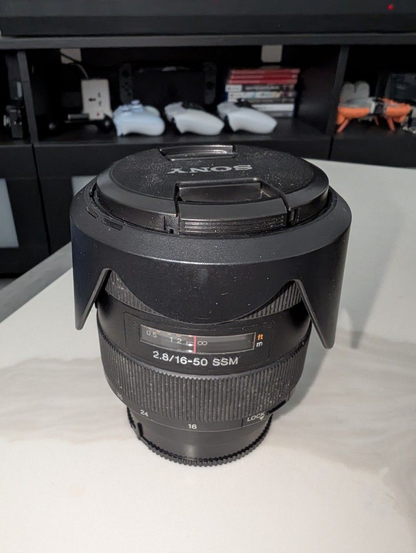 Sony 2.8/16-50 SSM Lens (Category: Lens & Kits) located in Santa Rosa. Submitted by vansting (Listing ID 1468505593, Image 1). Description: - Sony 16-50mm f/2.8 SSM zoom lens for Alpha mount DSLR cameras - Constant f/2.8 maximum aperture across the entire zoom range - Includes original front lens cap and dedicated petal lens hood - Cosmetically used with noticeable barrel dust and external wear - Glass elements may dumi.