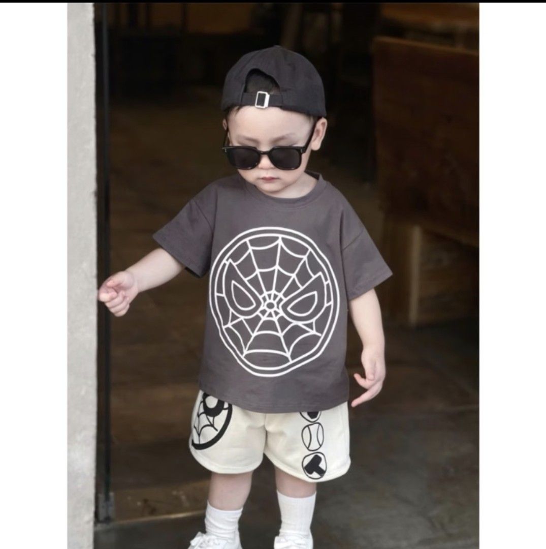 Spiderman Terno 2-3t (Category: Babies & Kids Fashion) located in Quezon City. Submitted by maypamor (Listing ID 1468515508, Image 2). Description: - Item: Spiderman Terno (Two-piece set) - Top: Dark grey with large web and eye graphic - Bottoms: Off-white shorts with cool black print details - Condition: Excellent - Perfect for toddler casual wear and daily lakad.