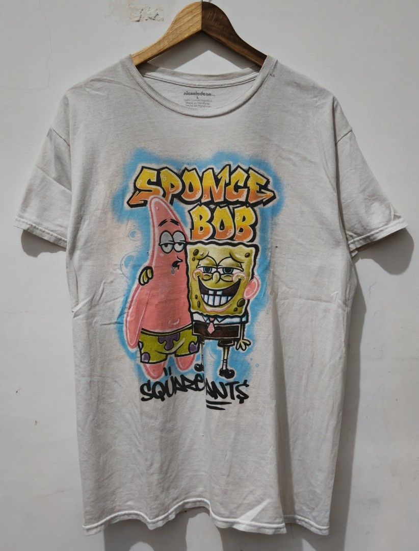 SpongeBob and Patrick Spray Graphics (Category: Tshirts & Polo Shirts ) located in Taguig. Submitted by thriftedminds (Listing ID 1468659235, Image 1). Description: Item: SpongeBob and Patrick🔥 ‎Size: Large (Nickelodeon) ‎Width: 21 ‎Length: 29.5 ‎Condition: Good ‎Issue: Pinhole, Deo stain DM to purchase 📩.