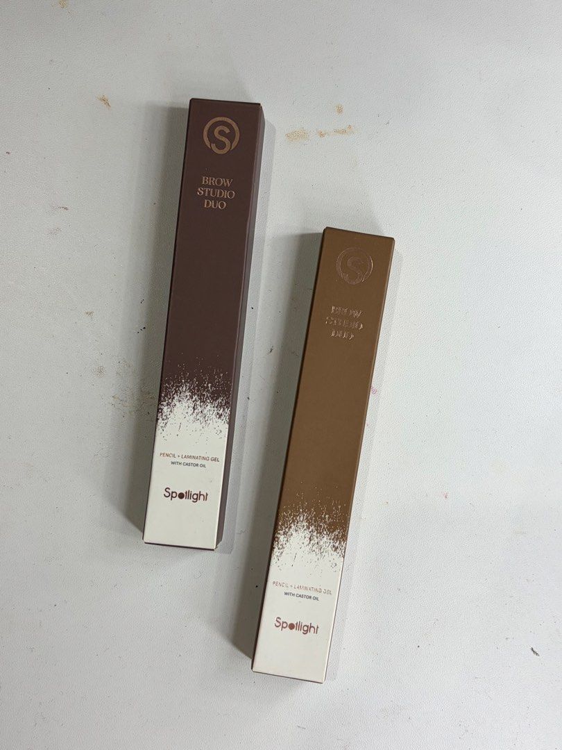 Spotlight Brow Studio Duo Pencil + Laminating Gel (Category: Makeup) located in Abucay. Submitted by declutterwyana (Listing ID 1468707151, Image 2). Description: - Brand new, unopened Spotlight Brow Studio Duo pens - Includes 2 shades: Burnt and Taupe - Dual-ended design featuring a brow pencil and laminating gel - Formula infused with castor oil for brow care - Ideal for everyday grooming and styling - Selling both shades together.