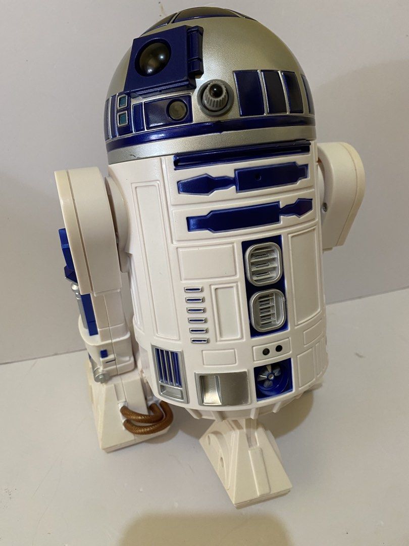 Star Wars R2-D2 Electronic Interactive Figure (Category: Figurines & Statues) located in Baguio. Submitted by thrift_bonita (Listing ID 1468558142, Image 2). Description: Star Wars R2-D2 droid figure. White and blue body with silver dome head. Movable legs and detailed panels across the front and back. Classic astromech design from the franchise. Solid plastic build..
