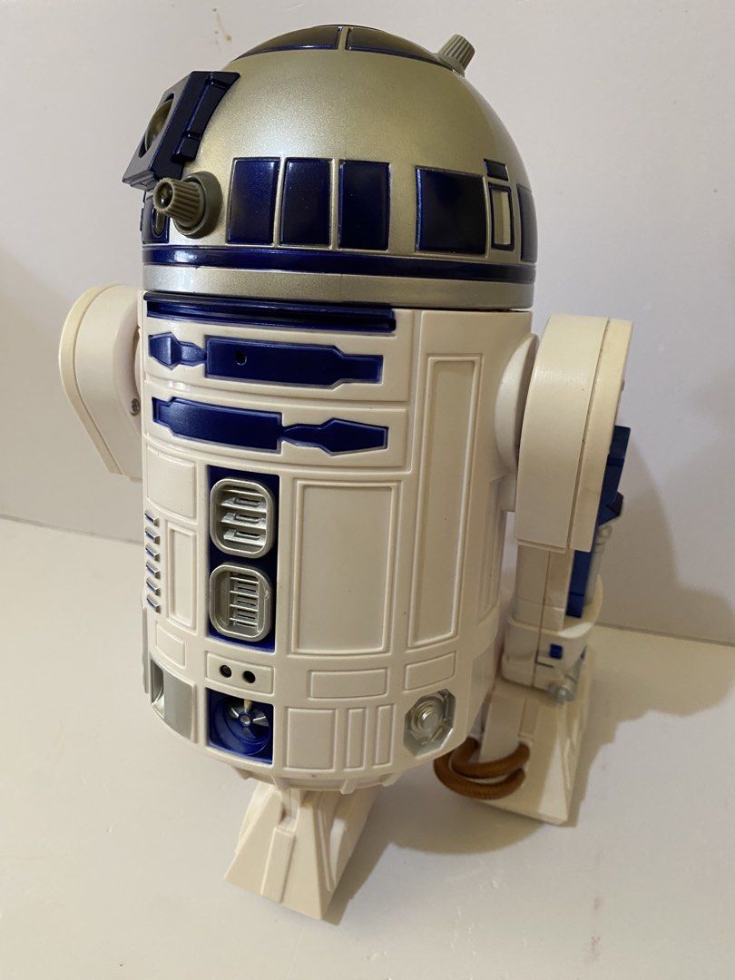 Star Wars R2-D2 Electronic Interactive Figure (Category: Figurines & Statues) located in Baguio. Submitted by thrift_bonita (Listing ID 1468558142, Image 3). Description: Star Wars R2-D2 droid figure. White and blue body with silver dome head. Movable legs and detailed panels across the front and back. Classic astromech design from the franchise. Solid plastic build..