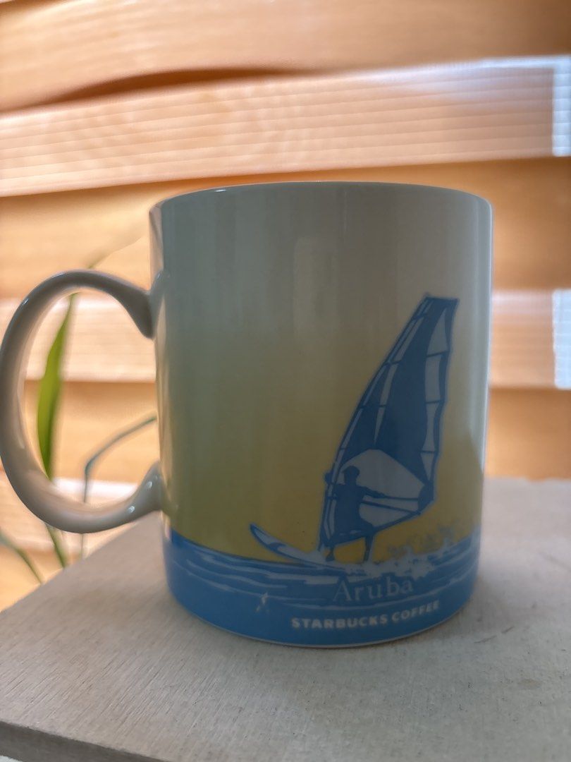 Starbucks Aruba 2016 Coffee Mug 16 oz (Category: Coffee & Tea Tableware) located in Malabon City. Submitted by luxgoals (Listing ID 1468526992, Image 2). Description: - Authentic Starbucks You Are Here Collection Aruba Mug - Dated 2016 on the bottom - Generous 16 fluid ounce capacity - Features iconic island graphics including a divi-divi tree and windsurfer - Stylish blue interior glaze - Microwave and dishwasher safe - Made in China - Condition