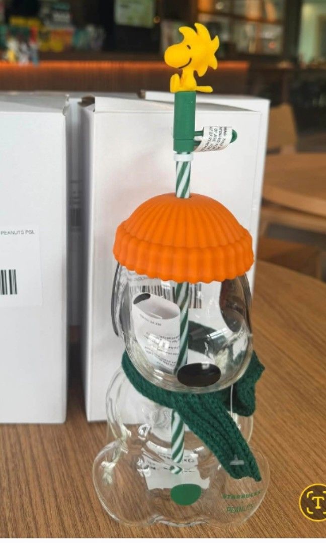 Starbucks x Peanuts Snoopy Glass Cup (Category: Water Bottles & Tumblers) located in Quezon City. Submitted by kctheexplorer05 (Listing ID 1468689332, Image 1). Description: - Adorable Snoopy-shaped clear glass water bottle - Comes with an orange winter hat lid and green scarf wrap - Includes a straw - Ideal for iced coffee, matcha lattes, and daily hydration - Doubles as charming tabletop decor when not in use -limited Edition -collectors item -
