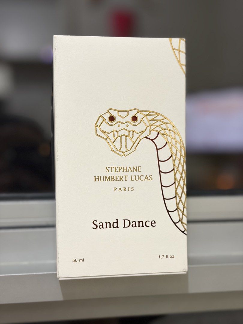 Stephane Humbert Lucas Sand Dance 50ml EDP (Category: Fragrance & Deodorants) located in Manila. Submitted by MisyeeelCunyaaa (Listing ID 1468652708, Image 2). Description: - Brand: Stephane Humbert Lucas - Fragrance: Sand Dance - Size: 50ml (Unisex) - Scent Profile: Warm spicy, woody, amber, cacao, and whiskey notes - Condition: Pristine, like new - Inclusions: Complete with original designer box and iconic decorative snake cap - 100% authentic 