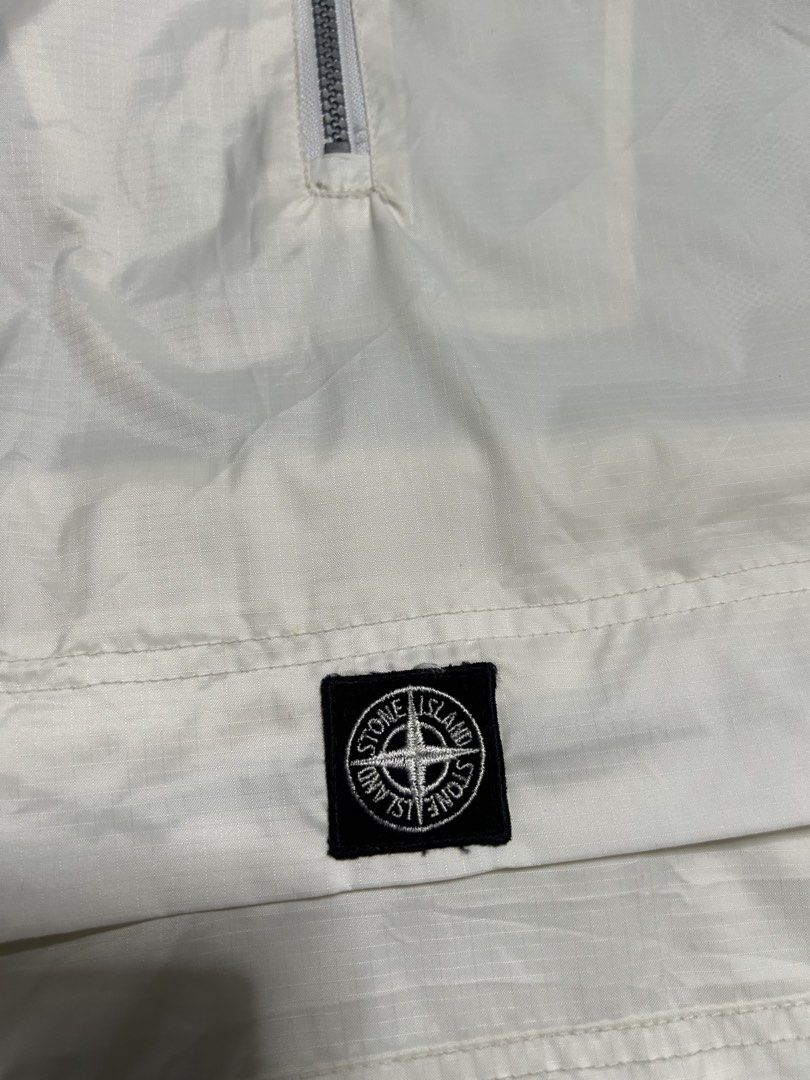 Stone island wind breaker (Category: Coats, Jackets and Outerwear) located in Trece Martires City. Submitted by flip_flips (Listing ID 1468527002, Image 2). Description: Stone island wind breaker -Dimes: 30 width 32 length -Excellent condition -9.5/10 color rate -issue: minor dot stains, cut wash tag.