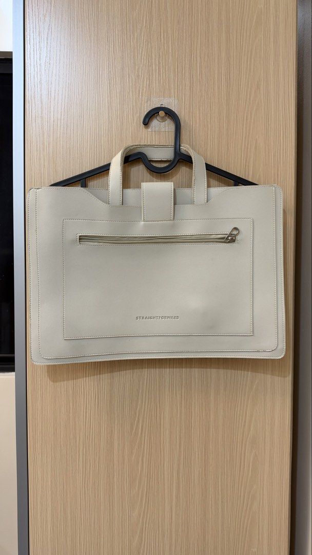 Straightforward Cream Leather Laptop Bag Briefcase (Category: Laptop Bags & Sleeves) located in Quezon City. Submitted by declutterw_v (Listing ID 1468682168, Image 1). Description: - Brand: Straightforward - Material: Premium cream-colored leather - Closure: Magnetic snap flap on one side - Storage: Zippered outer pocket on the reverse with embossed brand logo - Design: Slim profile, ideal for documents and thin laptops - Handles: Double top han