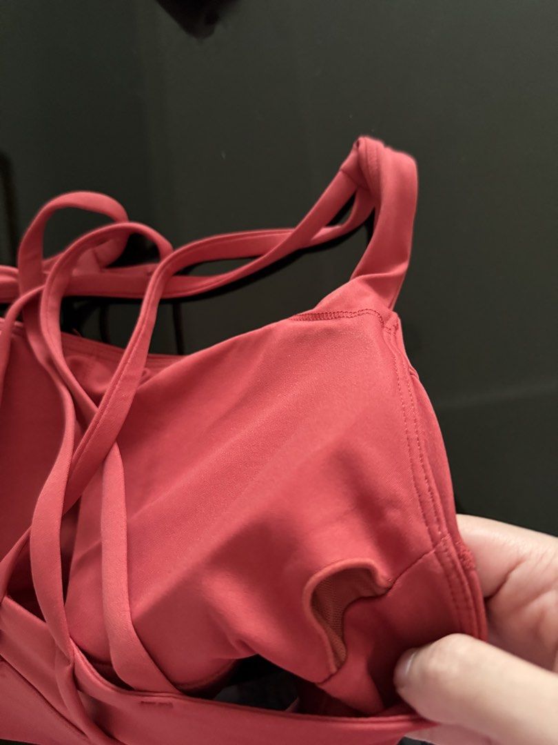 Strappy Sports Bra Pink Red (Category: Activewear) located in Mandaluyong City. Submitted by declutteringmylife101 (Listing ID 1468578049, Image 3). Description: - Color: Pinkish-red - Design: Trendy criss-cross back straps - Support: Wide underbust band for extra stability - Comfort: Soft and stretchy fabric - Padding: Includes removable cups with accessible inner slots - Condition: Brand new/Excellent quality - Perfect for gym, yoga, or everyda