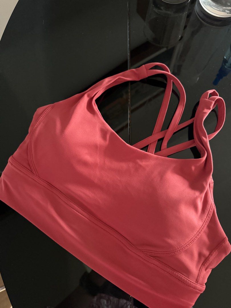 Strappy Sports Bra Pink Red (Category: Activewear) located in Mandaluyong City. Submitted by declutteringmylife101 (Listing ID 1468578049, Image 1). Description: - Color: Pinkish-red - Design: Trendy criss-cross back straps - Support: Wide underbust band for extra stability - Comfort: Soft and stretchy fabric - Padding: Includes removable cups with accessible inner slots - Condition: Brand new/Excellent quality - Perfect for gym, yoga, or everyda