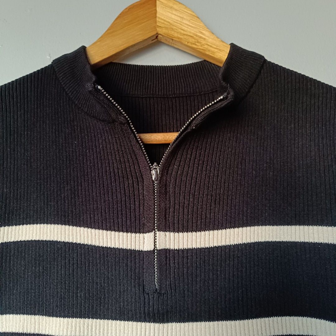 Striped Ribbed Half Zip Sleeveless Top (Category: Sleeveless) located in Manila. Submitted by its.me.jo (Listing ID 1468547936, Image 2). Description: - Color/Pattern: Black and cream stripes - Material: Soft ribbed knit - Details: Mock neck with a half-zip front closure - Style: Sleeveless, great for layering and transitional weather - Versatility: Pairs easily with both jeans and skirts - Condition: Clean and ready to wear (measurements availab