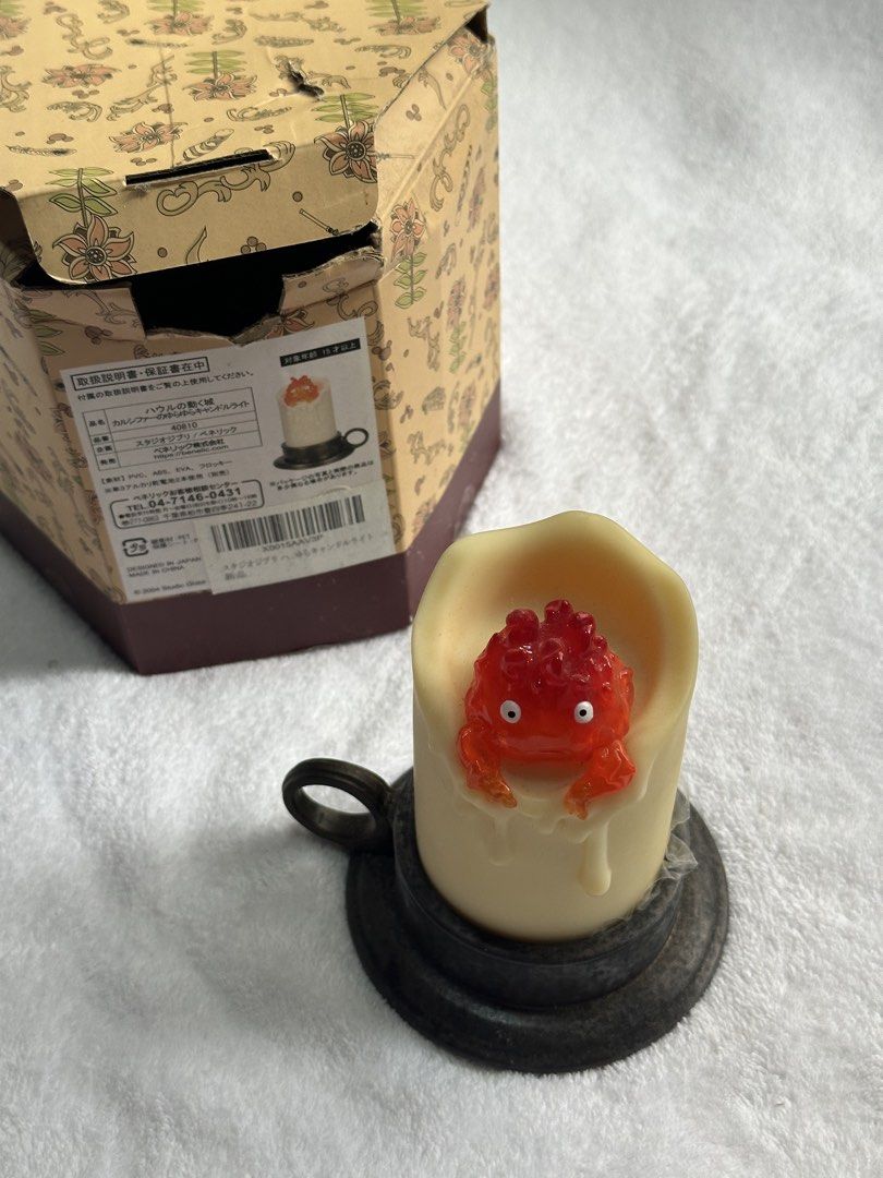 Studio Ghibli Calcifer flickering candle light official merch (Category: Character Goods) located in General Santos City (Dadiangas). Submitted by rosushi (Listing ID 1468524629, Image 3). Description: - Official Studio Ghibli merchandise (Howl's Moving Castle) - Character: Calcifer flickering candle light - Features detailed molten candle design with realistic flickering LED light - Authentic Japan import (Benelic) - Perfect collectible item or 