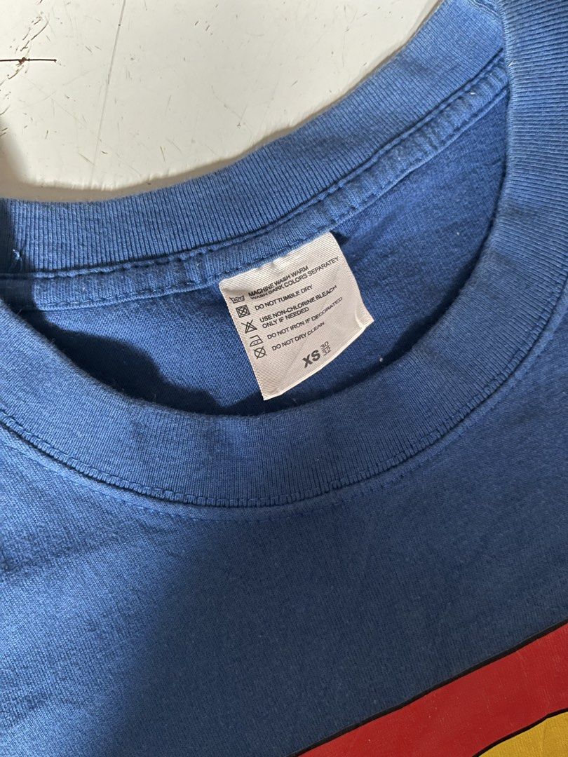 Superman Blue T-Shirt (Category: Shirts) located in Dagupan City. Submitted by shanadongsb (Listing ID 1468593581, Image 3). Description: - Authentic DC Comics Superman t-shirt in classic blue - Features the iconic red and yellow Superman logo on the chest - Crew neck and short sleeves for everyday comfort - Size: XS - Condition: Clean fabric, no stains, holes, or tears - Great casual wear for fans and collectors.