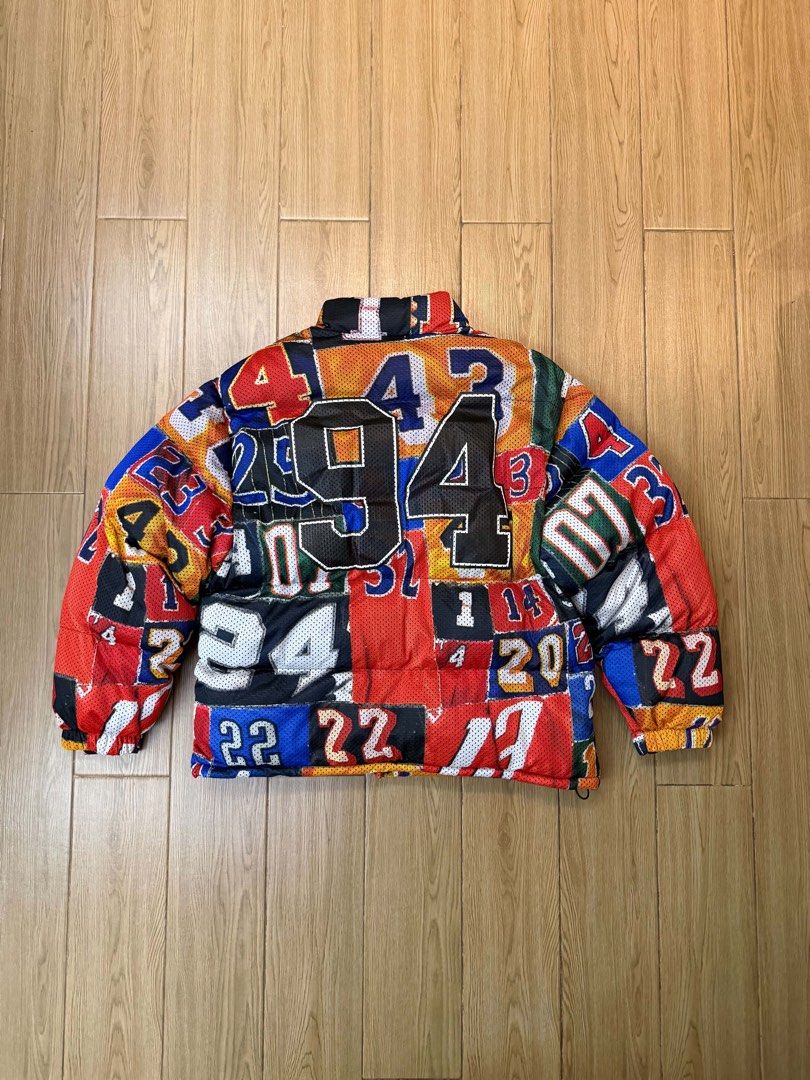 Supreme Mesh AOP Jersey Puffer Jacket Multicolor (Category: Coats, Jackets and Outerwear) located in Manila. Submitted by sleamdaily222 (Listing ID 1468708145, Image 2). Description: - Brand new with original Primaloft tags still attached - Supreme Jersey Arch Puffer Jacket with warm Primaloft insulation - Eye-catching all-over multi-colored jersey number print design - Large '94' graphic printed on the back - Classic black Supreme arch logo lett