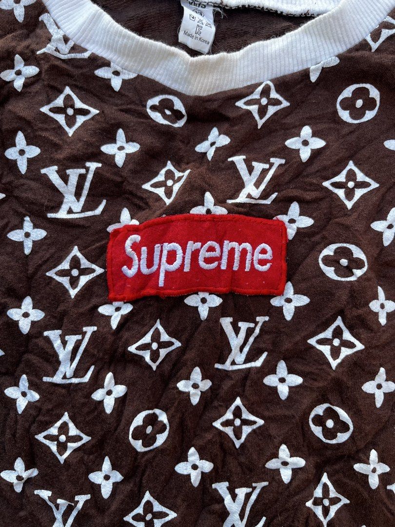 Supreme x Louis Vuitton Brown Monogram Sweatshirt (Category: Coats, Jackets and Outerwear) located in Calabanga. Submitted by jijithriftcamarinessur (Listing ID 1468507045, Image 3). Description: - Authentic Brown Supreme sweatshirt with white LV monogram print - Features the classic red box logo stitched on the chest - Comfortable white ribbed collar, cuffs, and hem - Standard crewneck pullover style with natural textured fabric - Includes neckl