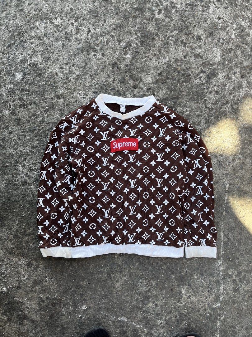Supreme x Louis Vuitton Brown Monogram Sweatshirt (Category: Coats, Jackets and Outerwear) located in Calabanga. Submitted by jijithriftcamarinessur (Listing ID 1468507045, Image 1). Description: - Authentic Brown Supreme sweatshirt with white LV monogram print - Features the classic red box logo stitched on the chest - Comfortable white ribbed collar, cuffs, and hem - Standard crewneck pullover style with natural textured fabric - Includes neckl