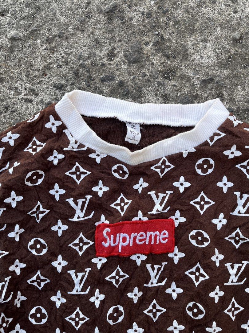 Supreme x Louis Vuitton Brown Monogram Sweatshirt (Category: Coats, Jackets and Outerwear) located in Calabanga. Submitted by jijithriftcamarinessur (Listing ID 1468507045, Image 2). Description: - Authentic Brown Supreme sweatshirt with white LV monogram print - Features the classic red box logo stitched on the chest - Comfortable white ribbed collar, cuffs, and hem - Standard crewneck pullover style with natural textured fabric - Includes neckl
