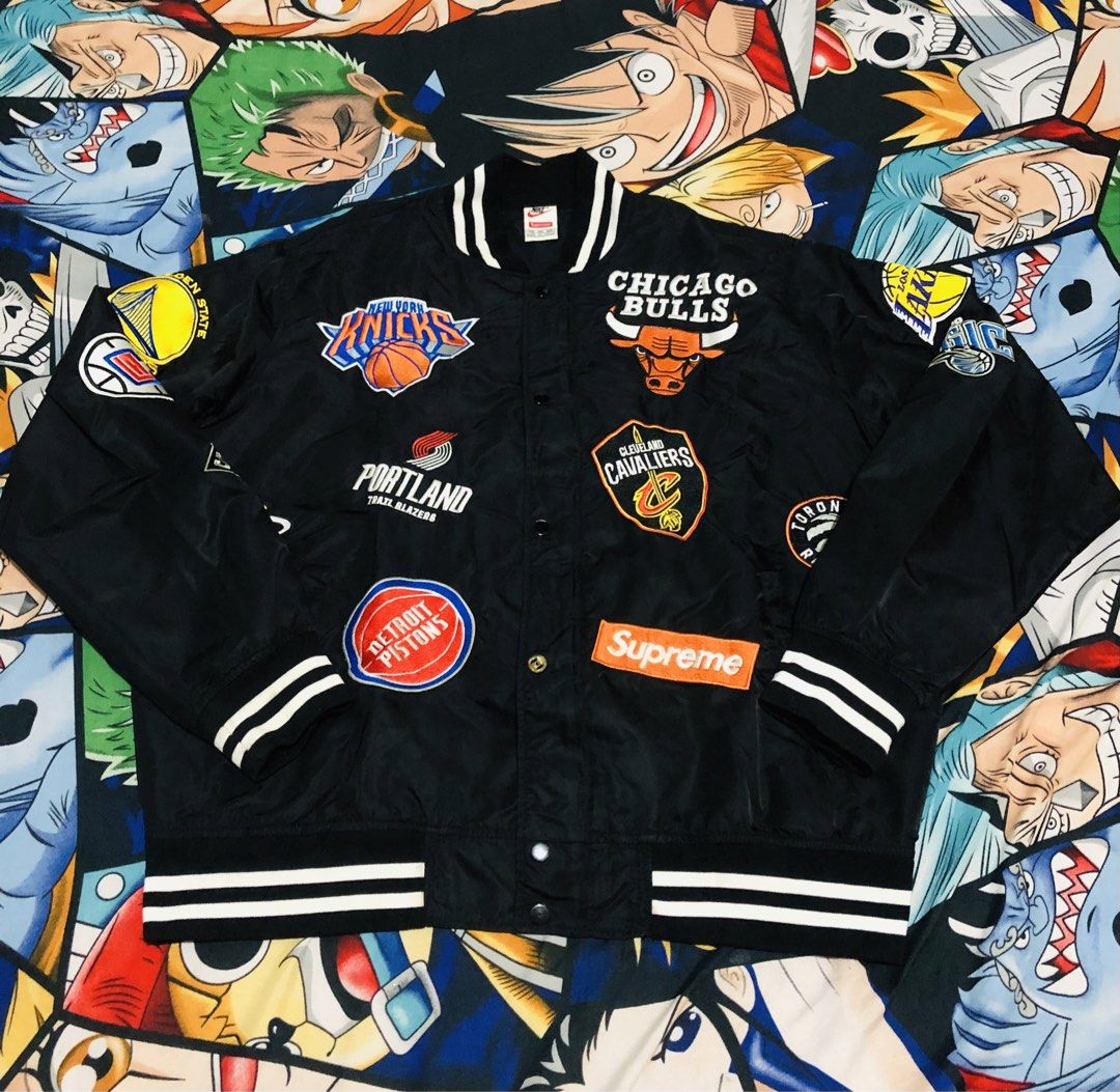 Supreme x Nike NBA Teams Bomber Jacket Black (Category: Coats, Jackets and Outerwear) located in Manila. Submitted by gobvs222 (Listing ID 1468699400, Image 2). Description: - Brand: Supreme x Nike - Style: NBA collaboration button-up jacket - Color: Black with all-over embroidered NBA team patches - Fit: Oversized streetwear style - Details: Striped ribbed collar, cuffs, and hem with bold branding - Condition: Excellent / Pre-loved (ready to wea