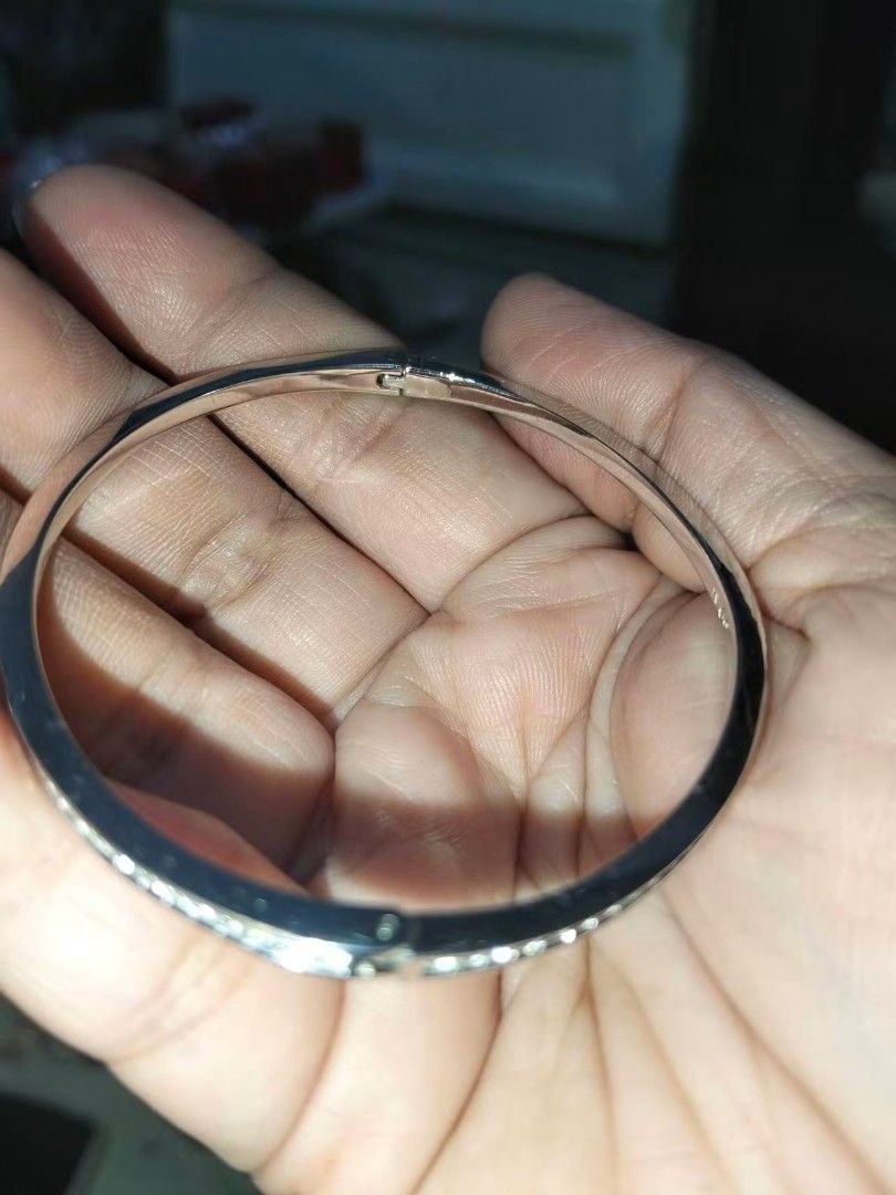 Swarovski Crystal Pave Bangle Silver Tone Size M (Category: Bracelets) located in Quezon City. Submitted by gemaicloset (Listing ID 1468655659, Image 2). Description: - Authentic Swarovski silver-tone bangle bracelet - Size M with secure hinged clasp closure - Sparkly clear crystals encrusted on the front half - Stamped with the iconic Swarovski swan logo on the inner band - Clean finish, ideal as a classic everyday accessory.
