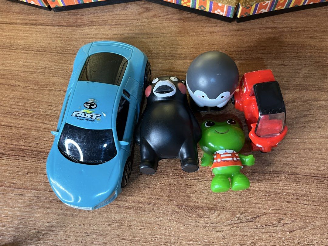 Take All Japan Assorted Toys Set (Category: Plushies & Soft Toys) located in Gapan. Submitted by lunashop14 (Listing ID 1468692190, Image 1). Description: - 5-piece toy bundle perfect for kids and collectors - Light blue fast sports car - McDonald's delivery vehicle with fries & drink graphics - Cute round penguin figure - Black bear toy - Green frog figurine in striped overalls - Selling as a set only.
