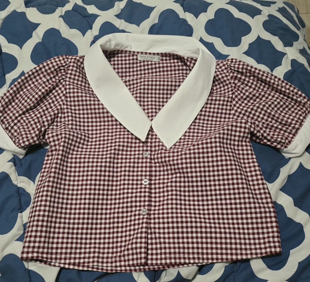 TAYO STUDIO Burgundy Gingham Collared Blouse Size 2 (Category: Blouses) located in Las Pinas. Submitted by insouciant_worrier (Listing ID 1468674676, Image 1). Description: - Brand: Tayo Studio - Size: 2 (Fits Medium to Large) - Pattern: Burgundy & white gingham - Details: Contrast white pointed collar and sleeve cuffs, button-down front with decorative buttons, puff short sleeves - Measurements: ~15" pit to pit, ~18" total length - Condition: Ex