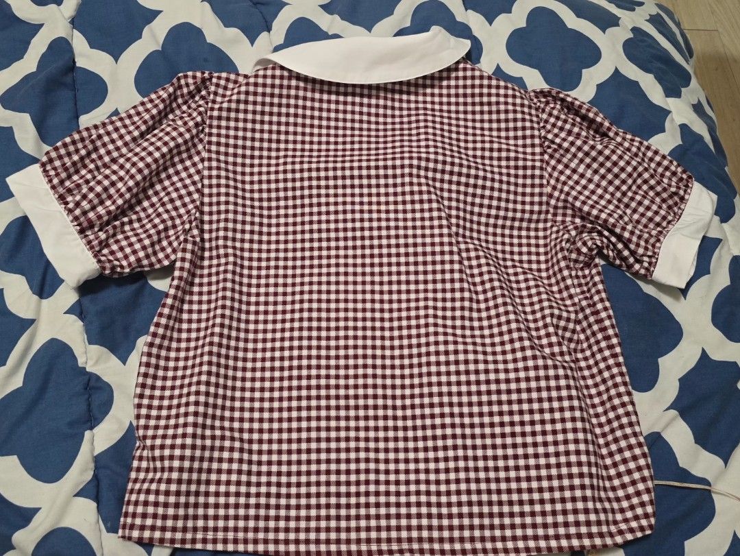 TAYO STUDIO Burgundy Gingham Collared Blouse Size 2 (Category: Blouses) located in Las Pinas. Submitted by insouciant_worrier (Listing ID 1468674676, Image 2). Description: - Brand: Tayo Studio - Size: 2 (Fits Medium to Large) - Pattern: Burgundy & white gingham - Details: Contrast white pointed collar and sleeve cuffs, button-down front with decorative buttons, puff short sleeves - Measurements: ~15" pit to pit, ~18" total length - Condition: Ex