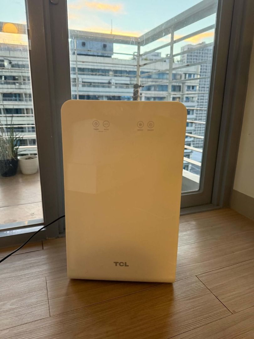 TCL Airopure Air Purifier with Touch Controls (Category: Air Purifiers & Dehumidifiers) located in Quezon City. Submitted by chadermeister (Listing ID 1468620931, Image 1). Description: - Type: Standing tower air purifier - Color: White and grey - Controls: Top touch panel for easy operation - Condition: Works well, with minor scuffs and marks on the grey front panel from normal use - Inclusions: Power cord attached - Benefit: Keeps indoor air cl