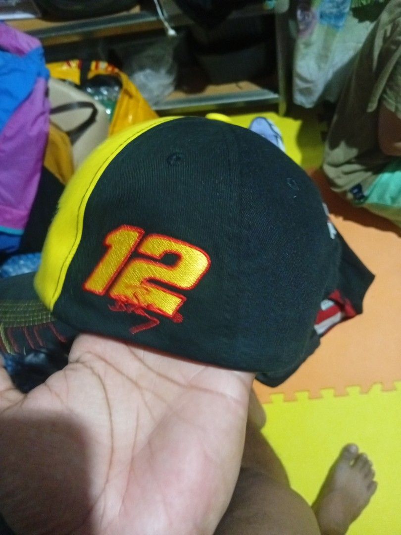 Team Penske Menards Racing Cap Hat Number 12 (Category: Caps & Hats) located in Quezon City. Submitted by asu06 (Listing ID 1468693057, Image 2). Description: - Authentic Team Penske Menards racing cap - Bold yellow and black colorway - Embroidered Menards logo on the front - Stitched number 12 on the side - 100% cotton shell for comfort - Adjustable back strap for a custom fit - Perfect for NASCAR fans and collectors - Condition: Brand new / Exc