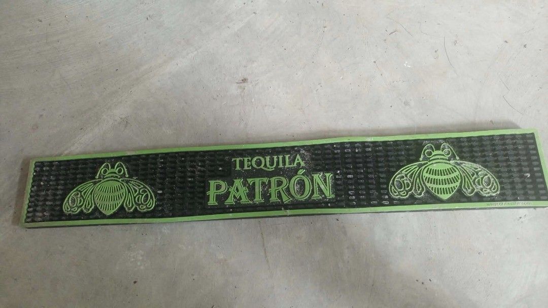 Tequila Patron Rubber Bar Mat Green Bee Logo (Category: Water Bottles & Tumblers) located in Mandaluyong City. Submitted by LEATHERFACE (Listing ID 1468550278, Image 1). Description: - Official Tequila Patron rubber bar mat - Striking black design with green lettering and iconic bee graphics - Textured surface traps spills and protects countertops - Heavy-duty rubber construction stays securely in place - Standard long runner size, easy to wipe c