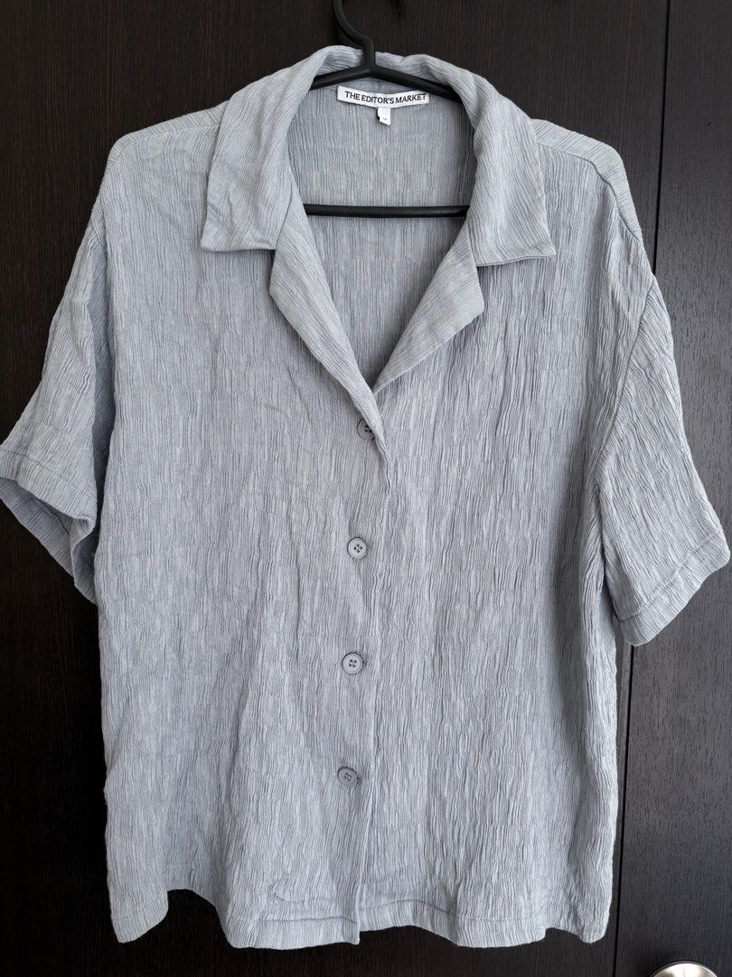 The Editor's Market Grey Button-Down Shirt Size M (Category: Shirts) located in Pasig City. Submitted by marias_wardrobe (Listing ID 1468513003, Image 1). Description: - Brand: The Editor's Market - Size: Medium - Color: Grey - Style: Camp collar, front button closure - Material: Textured crinkled fabric - Fit: Relaxed - Condition: Clean and ready to wear.