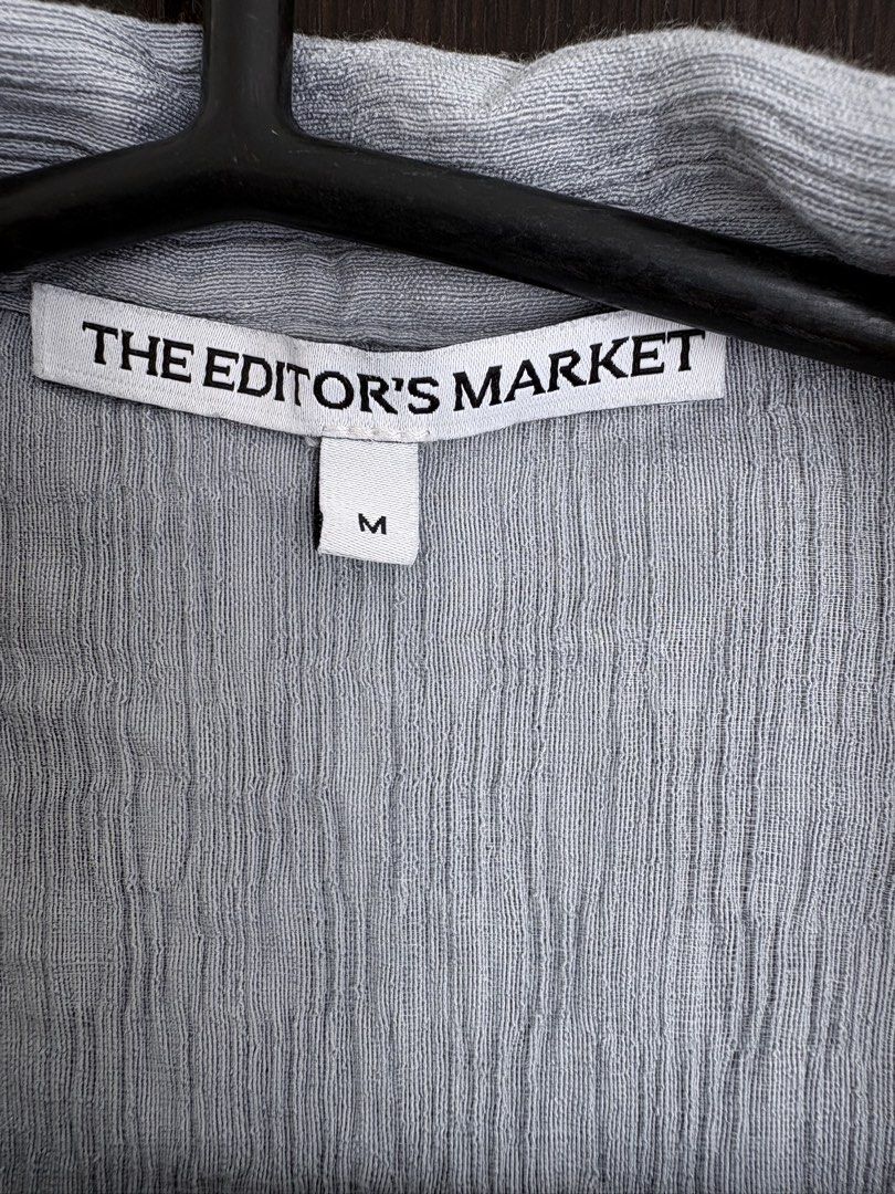 The Editor's Market Grey Button-Down Shirt Size M (Category: Shirts) located in Pasig City. Submitted by marias_wardrobe (Listing ID 1468513003, Image 2). Description: - Brand: The Editor's Market - Size: Medium - Color: Grey - Style: Camp collar, front button closure - Material: Textured crinkled fabric - Fit: Relaxed - Condition: Clean and ready to wear.