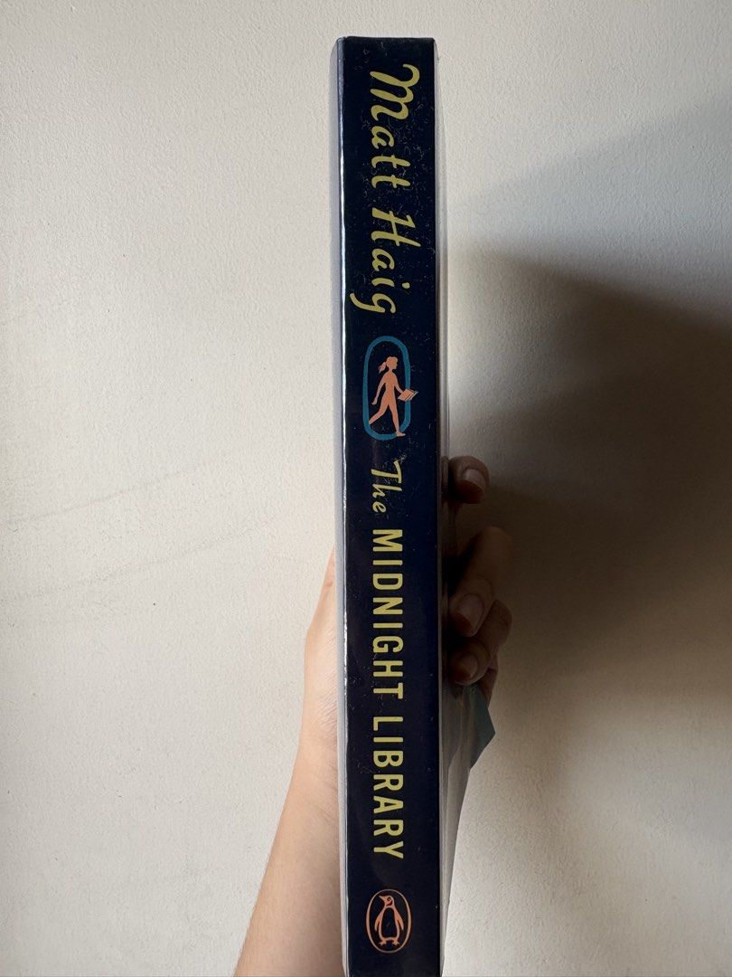 The Midnight Library by Matt Haig Paperback Novel (Category: Storybooks) located in Pasig City. Submitted by kairodri (Listing ID 1468523064, Image 3). Description: - Title: The Midnight Library by Matt Haig - Format: Paperback (Penguin Books) - Condition: Like new, read once, clean pages, and sharp corners - Highlights: #1 New York Times Bestseller - Price Tag: Original Fully Booked price sticker (₱499.00) intact - Genre: Contemporary fiction.
