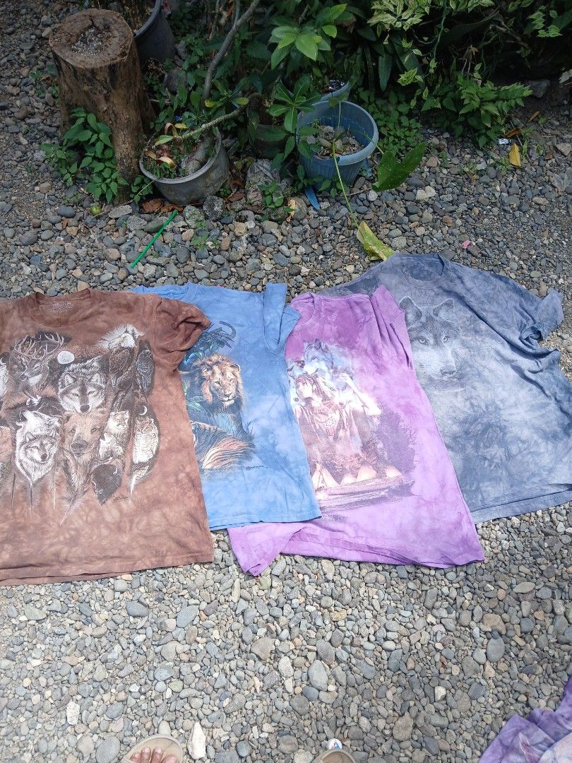The mountain Bundle (Category: Tshirts & Polo Shirts ) located in San Jose. Submitted by garments17 (Listing ID 1468558847, Image 1). Description: - Set of 4 graphic tees with unique animal prints - Designs: Grey wolf, purple fairy fantasy, blue lion, and brown multi-animal collage - Trendy tie-dye wash effect on all shirts - Comfortable short sleeves and classic crew neck - Material: 100% Cotton - Selling as a bundle only all xl.