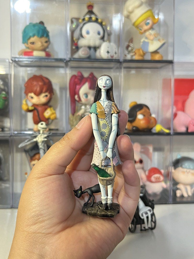The Nightmare Before Christmas Figures Set (Category: Figurines & Statues) located in Manila. Submitted by ana_maekes (Listing ID 1468684159, Image 2). Description: - The Nightmare Before Christmas collectible figures available as a bundle or individual pieces - Includes Jack Skellington with Zero and pumpkin base - Includes Sally with her black cat and basket - Includes Lock, Shock, and Barrel on a chained display base - Excellent detail on all 