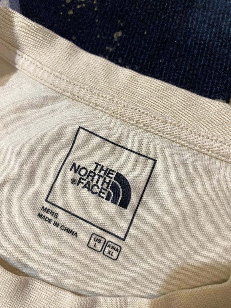 The North Face Earth Graphic Tee Off-White (Category: Tshirts & Polo Shirts ) located in Manila. Submitted by thrift_sta.20 (Listing ID 1468568362, Image 2). Description: - Brand: The North Face - Color: Off-white - Size: Men's US Large / Asia Extra Large - Material: 100% Cotton - Design: Small TNF chest logo with a large green 'No Place Like Earth Like The Present' back graphic - Fit: Regular short sleeve crewneck.