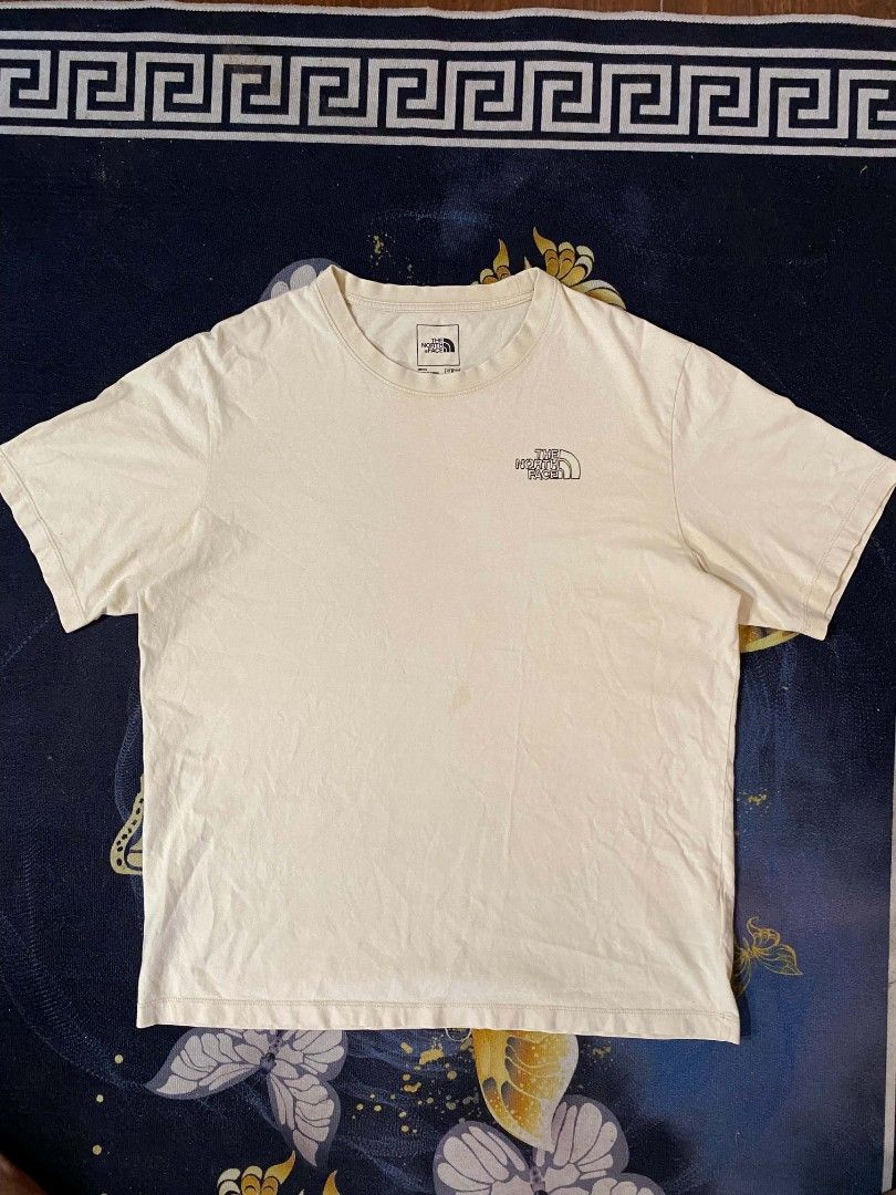 The North Face Earth Graphic Tee Off-White (Category: Tshirts & Polo Shirts ) located in Manila. Submitted by thrift_sta.20 (Listing ID 1468568362, Image 1). Description: - Brand: The North Face - Color: Off-white - Size: Men's US Large / Asia Extra Large - Material: 100% Cotton - Design: Small TNF chest logo with a large green 'No Place Like Earth Like The Present' back graphic - Fit: Regular short sleeve crewneck.
