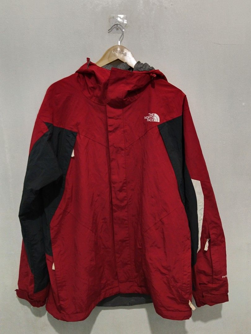 The North Face HyVent Men's Jacket Red/Black Large (Category: Coats, Jackets and Outerwear) located in Abucay. Submitted by ukay_withdj (Listing ID 1468534072, Image 1). Description: - Brand: The North Face - Model/Tech: Waterproof HyVent - Size: Men's L/G - Color: Red, black, and white colorblock - Features: Attached hood with adjustable drawcords, full zip front with storm flap, and stylish grey geometric interior lining - Authenticity: Include