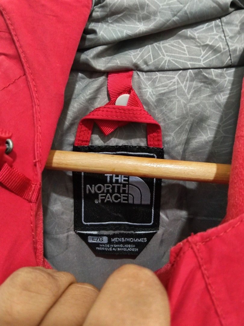 The North Face HyVent Men's Jacket Red/Black Large (Category: Coats, Jackets and Outerwear) located in Abucay. Submitted by ukay_withdj (Listing ID 1468534072, Image 3). Description: - Brand: The North Face - Model/Tech: Waterproof HyVent - Size: Men's L/G - Color: Red, black, and white colorblock - Features: Attached hood with adjustable drawcords, full zip front with storm flap, and stylish grey geometric interior lining - Authenticity: Include